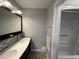 A full bathroom featuring double sinks, tiled backsplash, and a shower and tub at 920 N Waccamaw Dr. # 2206, Garden City Beach, SC 29576