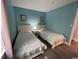 Comfortable bedroom featuring two twin beds, soft colors, and ample natural light at 920 N Waccamaw Dr. # 2206, Garden City Beach, SC 29576