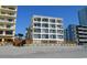 Building featuring private balconies and beach access at 920 N Waccamaw Dr. # 2206, Garden City Beach, SC 29576