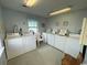 Community laundry room with multiple washers and dryers for residents' convenience at 920 N Waccamaw Dr. # 2206, Garden City Beach, SC 29576