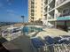 Oceanfront pool and lounge chairs create a relaxing atmosphere at this resort at 920 N Waccamaw Dr. # 2206, Garden City Beach, SC 29576
