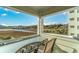 Serene balcony view overlooking a tranquil river, lush greenery, and picturesque houses in the distance at 9400 Shore Dr. # 411, Myrtle Beach, SC 29572