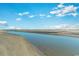 Tranquil coastal view featuring a serene river meeting the ocean, surrounded by sandy beaches at 9400 Shore Dr. # 411, Myrtle Beach, SC 29572