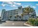 Beautiful Sands Beach Club exterior showcasing multiple levels, balconies and lush tropical landscaping at 9400 Shore Dr. # 411, Myrtle Beach, SC 29572