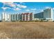 Relaxing coastal property surrounded by grassy beachfront, offering a tranquil atmosphere and breathtaking views at 9400 Shore Dr. # 411, Myrtle Beach, SC 29572