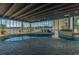 Indoor pool area surrounded by lush greenery and abundant natural light, perfect for year-round relaxation at 9400 Shore Dr. # 411, Myrtle Beach, SC 29572