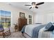 Sunny bedroom with natural light, windows and wood-look floors at 9466 Old Palmetto Dr., Murrells Inlet, SC 29576