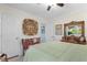Comfortable bedroom with soft light, decor, and a ceiling fan in a relaxing, neutral palette at 9466 Old Palmetto Dr., Murrells Inlet, SC 29576