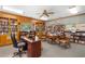 Inviting library with floor-to-ceiling bookshelves, creating a perfect space for reading and relaxation at 9466 Old Palmetto Dr., Murrells Inlet, SC 29576