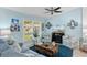 Comfortable living room with a large window, a TV, and cozy seating around a wooden coffee table at 9466 Old Palmetto Dr., Murrells Inlet, SC 29576