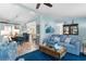 Open-concept living area with stylish furniture, a view of the dining area, and plenty of natural light at 9466 Old Palmetto Dr., Murrells Inlet, SC 29576
