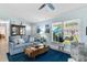 Cozy living room featuring blue walls, plush seating, and a decorative wooden coffee table at 9466 Old Palmetto Dr., Murrells Inlet, SC 29576