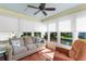 Cozy sunroom with tile flooring and large windows offering picturesque outdoor views at 9466 Old Palmetto Dr., Murrells Inlet, SC 29576