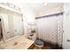 Well-lit bathroom with a shower-tub, vanity, and neutral decor at 950 Tiffany Ln., North Myrtle Beach, SC 29582