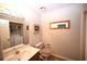 Updated bathroom with a vanity, sink, and an illuminated light fixture at 950 Tiffany Ln., North Myrtle Beach, SC 29582