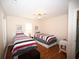 This bedroom offers two twin beds and a ceiling fan at 950 Tiffany Ln., North Myrtle Beach, SC 29582
