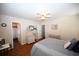Bright bedroom features a bed, ceiling fan, and ensuite bathroom at 950 Tiffany Ln., North Myrtle Beach, SC 29582