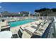 Community pool area with lounge chairs surrounded by white fencing and neighborhood homes at 950 Tiffany Ln., North Myrtle Beach, SC 29582