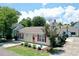 Charming home featuring a red door, shutters, and a well-manicured front yard with a decorative tree at 950 Tiffany Ln., North Myrtle Beach, SC 29582