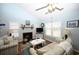 Comfortable living room with vaulted ceilings, fireplace, and bright windows at 950 Tiffany Ln., North Myrtle Beach, SC 29582