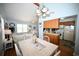 Open-concept kitchen, dining, and living room with hardwood floors and natural light at 950 Tiffany Ln., North Myrtle Beach, SC 29582