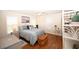 Bright main bedroom featuring a queen bed, ceiling fan and hardwood floors at 950 Tiffany Ln., North Myrtle Beach, SC 29582