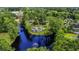 Secluded home surrounded by lush greenery and a tranquil pond with a fountain, creating a private oasis at 1028 Colette Ct, Conway, SC 29526