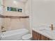 Bathroom features a tiled shower and tub, along with a sleek vanity and modern fixtures at 1028 Colette Ct, Conway, SC 29526