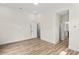 Spacious bedroom with modern lighting, luxury vinyl flooring, and ensuite bath at 1028 Colette Ct, Conway, SC 29526