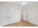 Bright, neutral bedroom with modern lighting, luxury vinyl floors, and closet at 1028 Colette Ct, Conway, SC 29526