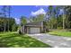 Home exterior with stone accents, modern garage door, and a well-manicured lawn, adding to its curb appeal at 1028 Colette Ct, Conway, SC 29526