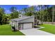 Beautiful home with a modern design, and lush green grass adding to its natural beauty and curb appeal at 1028 Colette Ct, Conway, SC 29526