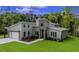 Stunning home with modern design and stone accents, complemented by a well-manicured lawn at 1028 Colette Ct, Conway, SC 29526