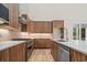 Modern kitchen with stainless steel appliances, marble countertops, and custom wood cabinets at 1028 Colette Ct, Conway, SC 29526
