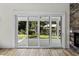 Living room with sliding glass doors leading to an outdoor patio with view of pond at 1028 Colette Ct, Conway, SC 29526