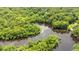 Aerial view of a property with a dock on a river surrounded by green trees and vegetation at 1032 Chelsey Circle, Conway, SC 29526