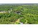 Aerial view of a property with a river surrounded by green trees and vegetation on a sunny day at 1032 Chelsey Circle, Conway, SC 29526