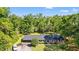 Aerial view of home on a large lot featuring mature trees, covered parking, and a shed at 1032 Chelsey Circle, Conway, SC 29526