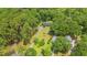 Aerial view of a property with a lush green lawn, mature trees, and two homes at 1032 Chelsey Circle, Conway, SC 29526