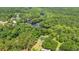 Aerial view of a property with a river surrounded by green trees and vegetation at 1032 Chelsey Circle, Conway, SC 29526
