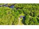 Aerial view of the property showcasing wooded surroundings, a pond, and a peaceful setting at 1032 Chelsey Circle, Conway, SC 29526
