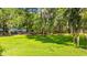 Tranquil backyard featuring a lake and mature trees covered in Spanish moss at 1032 Chelsey Circle, Conway, SC 29526