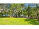 Lush backyard with mature trees and partial view of the waterfront at 1032 Chelsey Circle, Conway, SC 29526