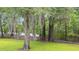 Beautiful waterfront backyard with majestic trees draped in Spanish moss offering serene views at 1032 Chelsey Circle, Conway, SC 29526