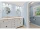 Bathroom with double sink vanity, marble countertop, and access to shower at 1032 Chelsey Circle, Conway, SC 29526