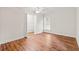 Neutral bedroom with wood floors, and access to a large closet with shelving at 1032 Chelsey Circle, Conway, SC 29526