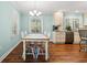 Dining area featuring hardwood floors, chandelier lighting, and ample natural light at 1032 Chelsey Circle, Conway, SC 29526