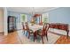 Formal dining room with hardwood floors, chandelier, and ample room for entertaining at 1032 Chelsey Circle, Conway, SC 29526