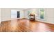 Open-concept living space featuring hardwood floors and an abundance of natural light at 1032 Chelsey Circle, Conway, SC 29526