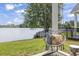 Enjoy the serene lake view from the backyard's charming swing, perfect for relaxing afternoons outdoors at 1048 Meadowoods Dr., Murrells Inlet, SC 29576